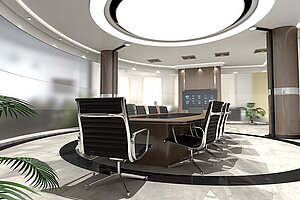 Foto eines runden Tisches mit Stühlen in einem futuristisch aussehenden Büroraum